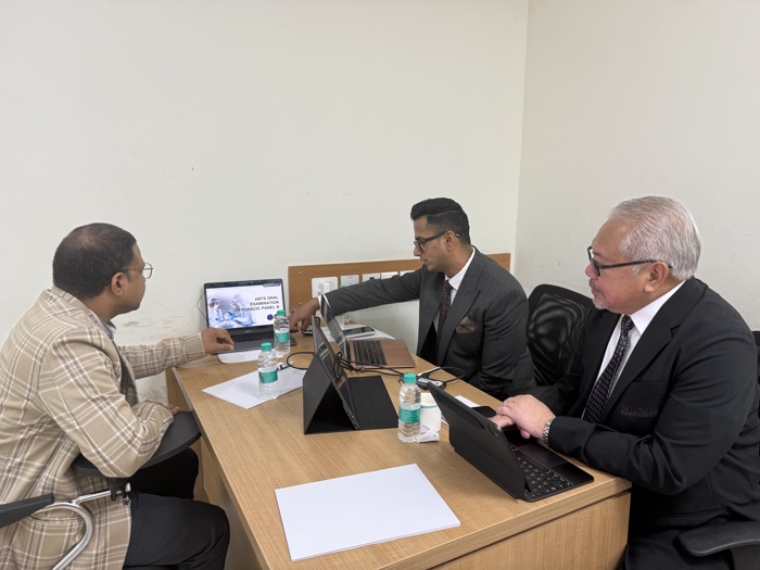 ABTS examiners discussing a candidate's oral assessment